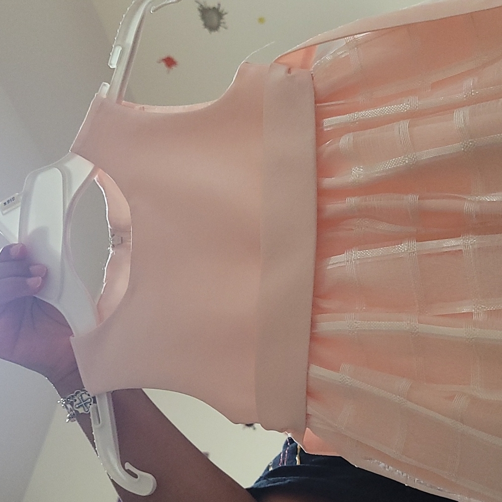 Pink American Princess dress with square pattern and waist belt. Size 2T